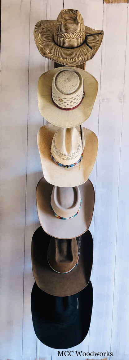 "The Showman" 6- Hat Vertical Cowboy Hat Rack handcrafted from pine holding six cowboy hats on a wall. 