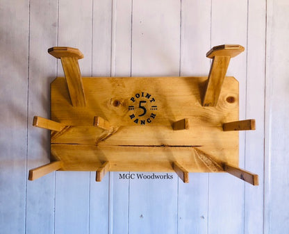 "High Noon" 6- Hat Cowboy Hat Rack handcrafted from pine holding six cowboy hats on a wall. 