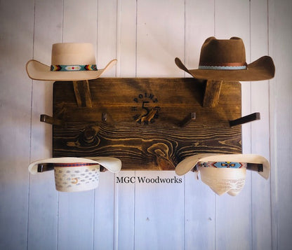 "High Noon" 6- Hat Cowboy Hat Rack handcrafted from dark stained pine holding six cowboy hats on a wall. 
